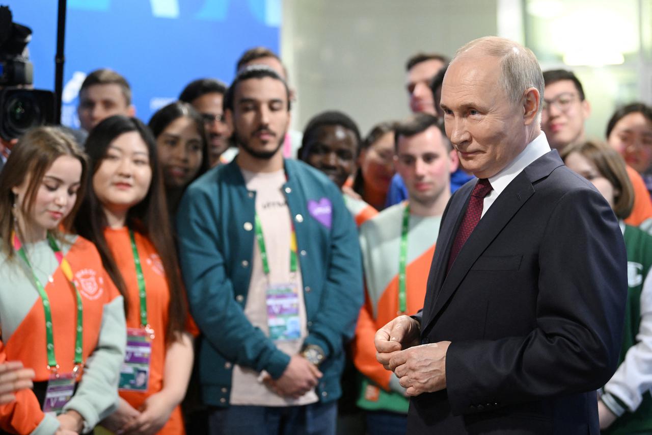 Russian President Vladimir Putin meets with participants of the World Youth Festival in the federal territory of Sirius near Sochi, Russia